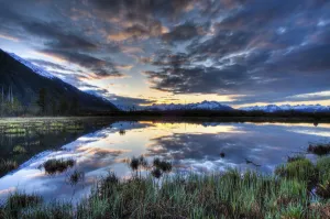 Morning Sky Reflecting On A Pond Near The Copper River Highway Outside Of Cordova, Southcentral Alaska, Spring. Hdr Morning Sky Reflecting On A Pond Near The Copper River Highway Outside Of Cordova, Southcentral Alaska, Spring. Hdr
