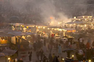 Morocco, People and food stalls in Place Djemaa el Fna at dusk; Marrakesh Morocco, People and food stalls in Place Djemaa el Fna at dusk; Marrakesh