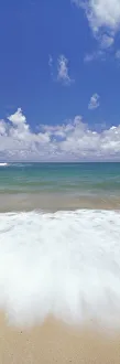 Ocean Shore Break Action Upon Shoreline, Turquoise Water And Blue Sky With Clouds Ocean Shore Break Action Upon Shoreline, Turquoise Water And Blue Sky With Clouds