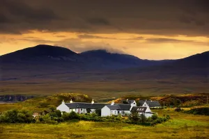 Paps Of Jura, Jura, Scotland; Houses With Mountain Backdrop Paps Of Jura, Jura, Scotland; Houses With Mountain Backdrop
