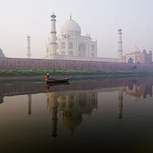 Person In Boat In Front Of Taj Mahal; Agra, India Person In Boat In Front Of Taj Mahal; Agra, India