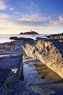 Rocky Coastline and Lighthouse, Godrevy Point, Cornwall, England Rocky Coastline and Lighthouse, Godrevy Point, Cornwall, England