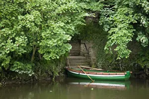 A Row Boat Roped At Some Stairs Along The Shore; Warkworth, Northumberland, England A Row Boat Roped At Some Stairs Along The Shore; Warkworth, Northumberland, England