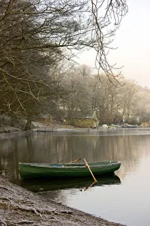 Rowboat Sitting At The Shore Of A Lake, Cumbria, England Rowboat Sitting At The Shore Of A Lake, Cumbria, England