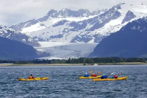 Sea Kayakers In Gastineau Channel With Mendenhall Glacier And Coast Mountains In The Background In Southeast Alaska Sea Kayakers In Gastineau Channel With Mendenhall Glacier And Coast Mountains In The Background In Southeast Alaska