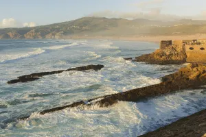 Stone walls of an old fort, Praia do Guincho near Cascais, Lisbon, Portugal Stone walls of an old fort, Praia do Guincho near Cascais, Lisbon, Portugal