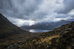 Sun breaking through heavy cloud near Kinlochewe, Torridon; Scotland, United Kingdom Sun breaking through heavy cloud near Kinlochewe, Torridon; Scotland, United Kingdom