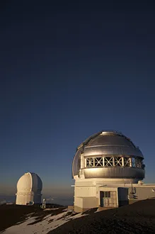 The Sun Sets Over The Summit Of Mauna Kea And The Domed Observatories And Telescopes; Island Of Hawaii, Hawaii The Sun Sets Over The Summit Of Mauna Kea And The Domed Observatories And Telescopes; Island Of Hawaii, Hawaii