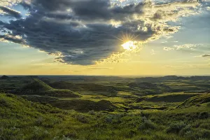 The Sun Shines Through A Cloud Over The Killdeer Badlands The Sun Shines Through A Cloud Over The Killdeer Badlands