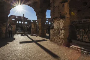 Sunburst Through An Archway At The Colosseum And A Shadow Of A Cross; Rome, Italy Sunburst Through An Archway At The Colosseum And A Shadow Of A Cross; Rome, Italy