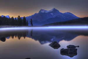 Sunrise On A Foggy Maligne Lake In Jasper National Park, Alberta Sunrise On A Foggy Maligne Lake In Jasper National Park, Alberta