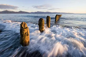 Surf Rushing Around Old Pilings Along Beach Homer Spit Kachemak Bay Alaska Summer Surf Rushing Around Old Pilings Along Beach Homer Spit Kachemak Bay Alaska Summer
