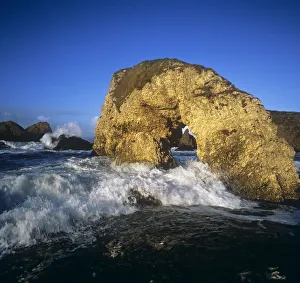 Wave Splashing Against Natural Arch, Antrim Coast, County Antrim, Northern Ireland Wave Splashing Against Natural Arch, Antrim Coast, County Antrim, Northern Ireland