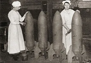 Women putting a coat of paint on aerial bombs during WWI. From The Pageant of the Century, published 1934 Women putting a coat of paint on aerial bombs during WWI. From The Pageant of the Century, published 1934