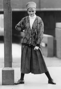 1980s Women's Fashion: Our model wears. Diamond pattern cardigan over a white turtle 1980s Women's Fashion: Our model wears. Diamond pattern cardigan over a white turtle