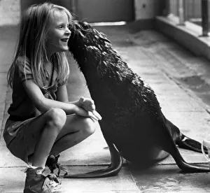 7 year old Nicky Wilson makes friends with Grumpy the sea lion at Knowsley Safari Park 7 year old Nicky Wilson makes friends with Grumpy the sea lion at Knowsley Safari Park