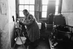 71 year old Edna Clarke does her washing in the communal wash house at Great Eastern 71 year old Edna Clarke does her washing in the communal wash house at Great Eastern