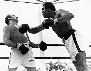 Action during the heavyweight world title fight between American Muhammad Ali Action during the heavyweight world title fight between American Muhammad Ali