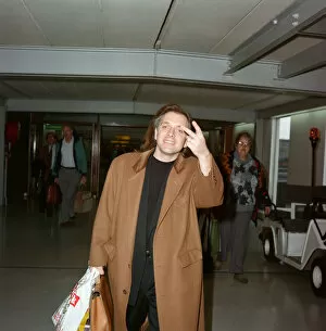 Images Dated 29th March 1992: Actor and comedian, Rik Mayall, pictured at London Airport. 29th March 1992