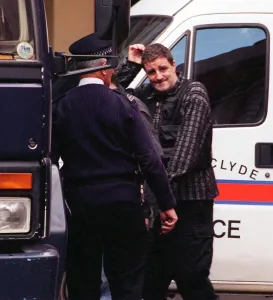 Actor Iain McColl is led away from court into a police van after he was remanded in Actor Iain McColl is led away from court into a police van after he was remanded in