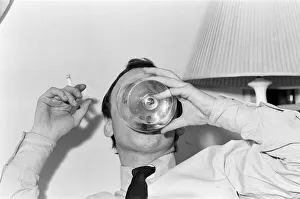 Actor John Thaw relaxing at home in London with a brandy. 30th March 1966 Actor John Thaw relaxing at home in London with a brandy. 30th March 1966