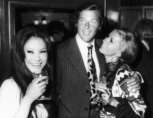 Actor Roger Moore with his Italian wife Louisa - July 1970 And Michael Caine' Actor Roger Moore with his Italian wife Louisa - July 1970 And Michael Caine'