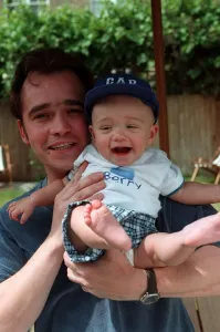 Actor Todd Carty with baby son James at home June 1997 Actor Todd Carty with baby son James at home June 1997