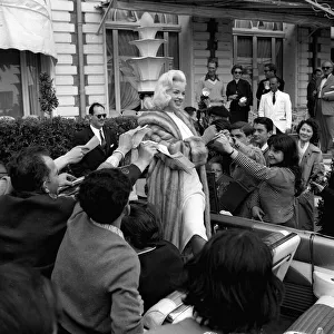 Actress Diana Dors surrounded by autograph hunters at Cannes Film Festival Actress Diana Dors surrounded by autograph hunters at Cannes Film Festival