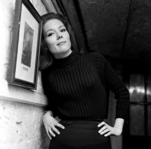Actress Diana Rigg, star of The New Avengers, leaning against a wall with her hands Actress Diana Rigg, star of The New Avengers, leaning against a wall with her hands