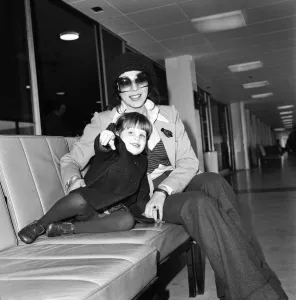 Actress Joan Collins and her 2 year old daughter Katyania leaving Heathrow airport for Actress Joan Collins and her 2 year old daughter Katyania leaving Heathrow airport for