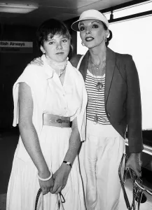 Actress Joan Collins with her daughter at Heathrow airport. August 1980 Actress Joan Collins with her daughter at Heathrow airport. August 1980