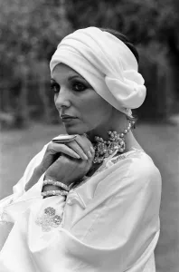 Actress Joan Collins modelling outfits that she will wear on a trip to Tokyo to judge a Actress Joan Collins modelling outfits that she will wear on a trip to Tokyo to judge a