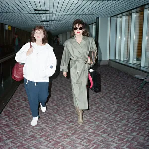 Actresses Joan Collins and Pauline Collins at Heathrow Airport. 8th April 1990 Actresses Joan Collins and Pauline Collins at Heathrow Airport. 8th April 1990
