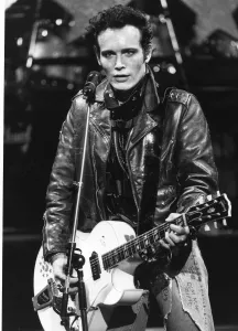 Adam Ant British pop singer playing guitar on stage 1985 Adam Ant British pop singer playing guitar on stage 1985