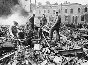 Wreckage Collection: Air raid damage to Barking Road in East London during the Blitz. 20th March 1941