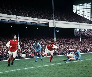 Alan Ball of Arsenal passes the ball to a team mate during their league match against Alan Ball of Arsenal passes the ball to a team mate during their league match against