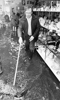 Alan Finney owner of the K Centre shop in Linthorpe seen here helping to bail out water Alan Finney owner of the K Centre shop in Linthorpe seen here helping to bail out water