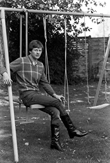 Alex Higgins former World Snooker Champion 1983 has a swing in his garden Alex Higgins former World Snooker Champion 1983 has a swing in his garden