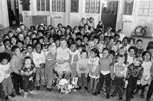 All smiles... pupils from Woodhouse Infant and Nursery School raise a cheer for Mrs All smiles... pupils from Woodhouse Infant and Nursery School raise a cheer for Mrs