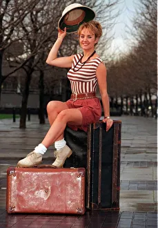 Amanda Reddington actress sitting on suitcase Amanda Reddington actress sitting on suitcase