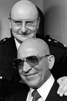 American actor Telly Savalas (bottom) who plays Kojak in the television series American actor Telly Savalas (bottom) who plays Kojak in the television series