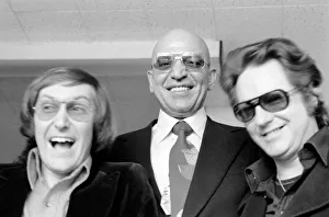 American actor Telly Savalas with Yin (left) and Yan, two pop singers who have made a American actor Telly Savalas with Yin (left) and Yan, two pop singers who have made a
