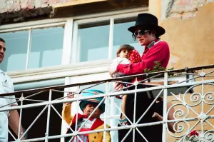 American pop singer Michael Jackson with young orphan Bela Farkas posing on a hotel American pop singer Michael Jackson with young orphan Bela Farkas posing on a hotel