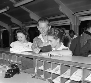 American rock and roll singer Jerry Lee Lewis signs immigration cards with his thirteen American rock and roll singer Jerry Lee Lewis signs immigration cards with his thirteen