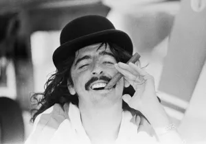 American rock singer Alice Cooper wearing a bowler hat and smoking a cigar during his American rock singer Alice Cooper wearing a bowler hat and smoking a cigar during his
