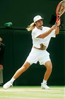 Images Dated 4th July 1992: Andre Agassi plays John McEnroe in the Mens Singles Semi-Final Tennis at Wimbledon