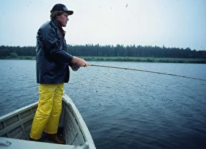 Andy Bean golfer August 1978 Standing in rowing boat fishing angling waterproofs Andy Bean golfer August 1978 Standing in rowing boat fishing angling waterproofs