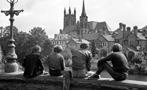 Angling. Young boys sitting on a bridge parapet fishing in the River Leam at Leamington Angling. Young boys sitting on a bridge parapet fishing in the River Leam at Leamington