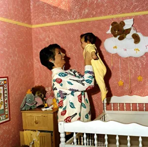 Anne Diamond cuddles tiny Clemency one of the babies used in the ad Anne Diamond cuddles tiny Clemency one of the babies used in the ad