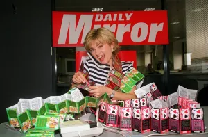 Anthea Turner TV Presenter mans the Daily Mirror National Lottery Scratchcards Anthea Turner TV Presenter mans the Daily Mirror National Lottery Scratchcards